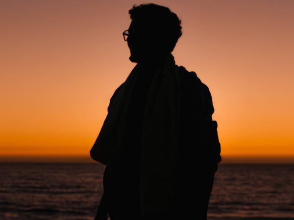 Silhouette of a person against a sunset